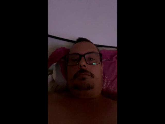 Several red and white German-style Iron Crosses in a row, centered. The crosses have a metallic sheen with a simple, bold design. The closest cross is slightly larger.