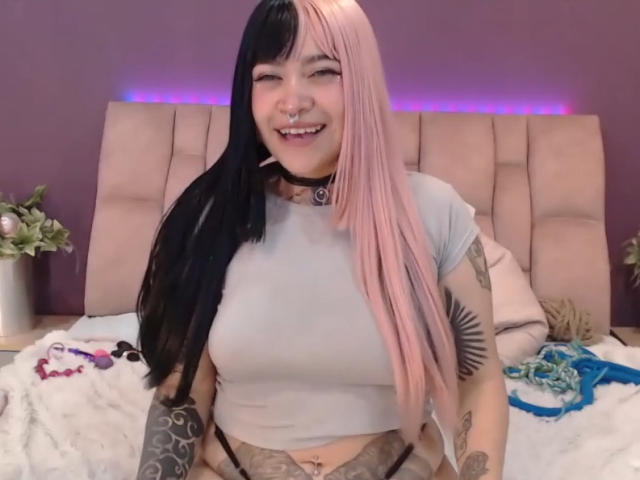 Digital art of four stylized, overlapping flags with bold, flat colors. Flags are positioned in a vertical line, each with distinct, minimalist shapes and simple design. Bright, contrasting colors.