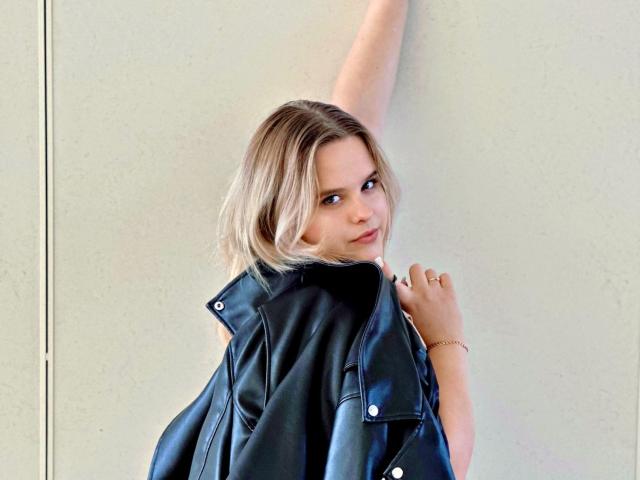 Minimalist design with bold, flat colors. Central "L" shape with red, white, and blue elements. Simple, clean lines. Modern, geometric style. Flat colors and subtle gradients. No text or logos.