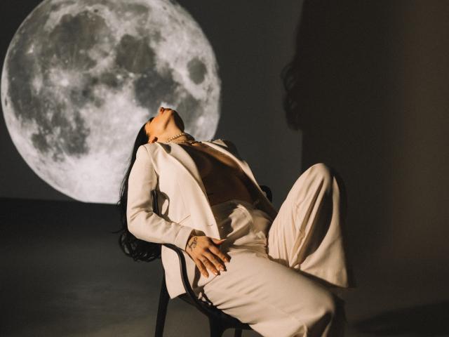 Digital artwork of a single, large, white, stylized letter "A" centered in the frame. Minimalistic, flat color, no shading. Simple, clean lines, modern design. LayaGorgeous not present.