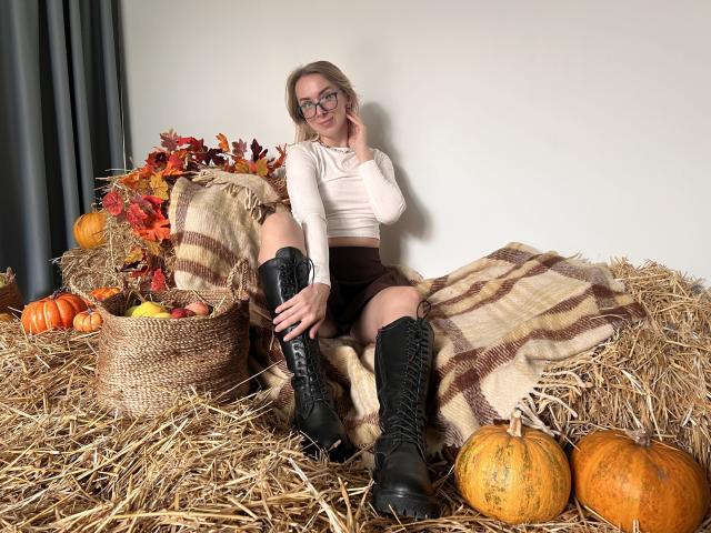 Digital illustration of a minimalist Korean flag with red and blue tassels, centered over a subtle white and pink gradient. Flat colors, clean lines, and geometric patterns dominate.