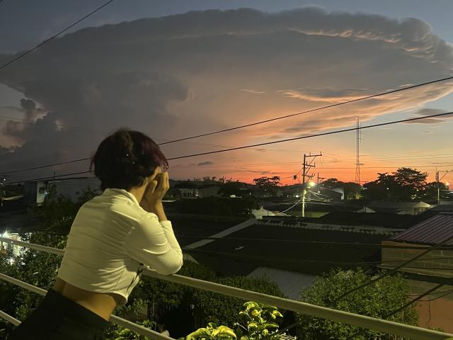 A flat, minimalist style map-like illustration with a large, solid red "B" in the center. The "B" has a small yellow emblem in the bottom right.