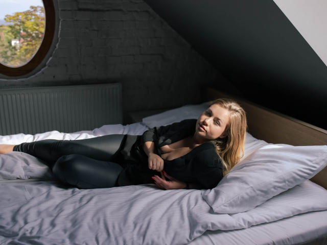 Graphic design of a minimalist, bold, black and red emblem with a central, stylized, white mountain-like shape. Simple, geometric lines and flat colors. Clean, modern aesthetic. HollyCandyX is not present.