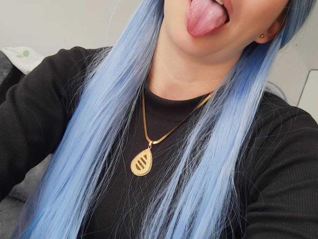 Minimalist digital illustration of a stylized, vertical emblem with a red and white design, featuring subtle diagonal lines and a central, slightly raised element. Clean, geometric composition.