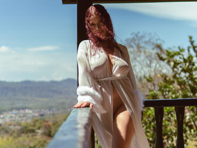 Flag-like emblem with a bold red cross on a white background, bordered by a narrow black edge. The design is minimalistic and symmetrical, featuring clean lines and solid colors.