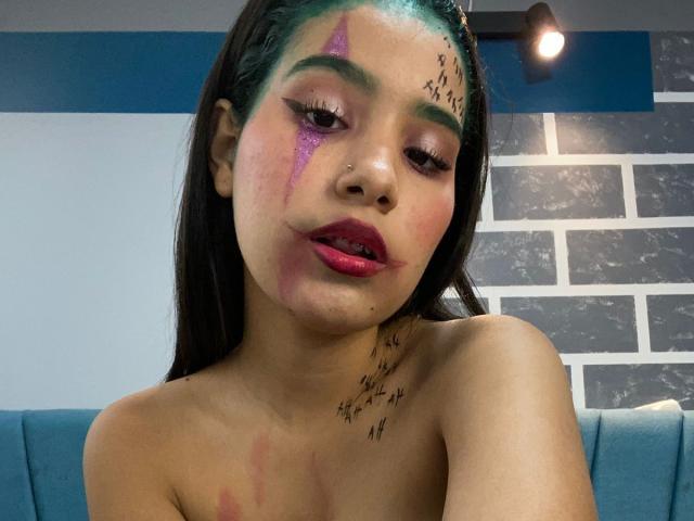 Stylized digital art of a bold, blocky letter "E" in a dark, muted color with subtle red highlights. Simple, flat design with minimal shadows and clean lines.