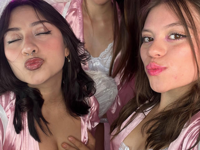 VictoriaAngels with pink satin robe, glittery eye makeup, nose ring, pouty lips, and brown hair in two selfies. White lace bra visible in the center shot.