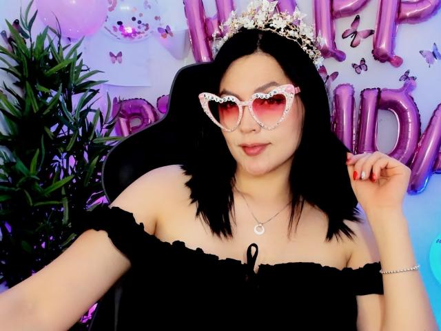 Digital art of a stylized, geometric banner with a pinkish-red center and dark pink accents. Includes a small, pink, abstract symbol in the top left. Clean, minimalistic design.