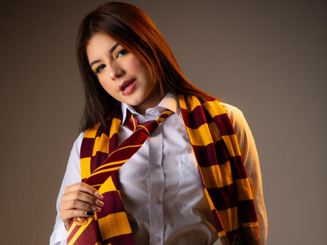 Digital art of a stylized, semi-transparent, orange and white lion's head emblem in the center. Soft gradients and subtle shadows. Minimalistic design with a focus on the emblem's form.