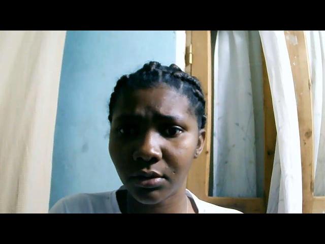 A minimalist illustration featuring a large, flat, pale-colored letter "E" in the center. The letter has a slight shadow, giving it a subtle three-dimensional effect. Simple, clean design.