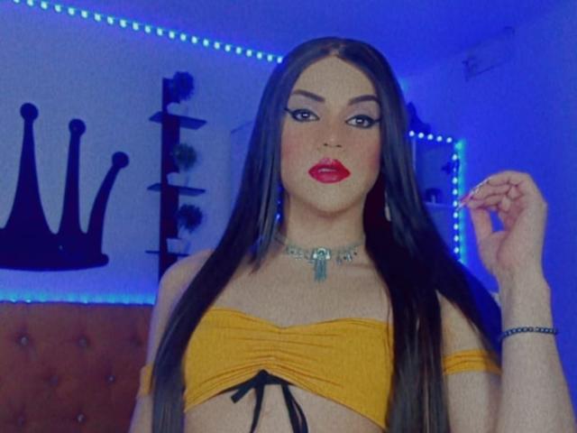 GeishaSenier with long black hair, yellow strapless top showing small tits, red lipstick, blue LED strip background, silver choker, hand raised, looking at camera, sexy, confident.
