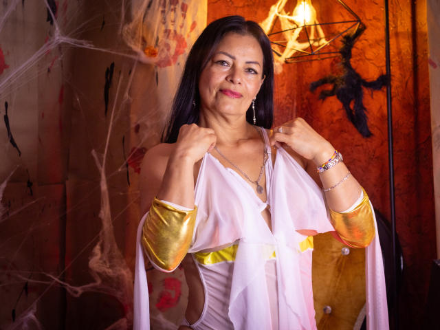 A minimalist, stylized, red and yellow logo with bold, angular shapes. The logo has a cut-out effect, revealing white space behind. Clean, modern design with sharp contrasts.