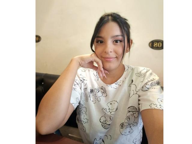 Three large, flat, beige letters "E" stacked vertically with a smaller, black, stylized "E" in the bottom right. Simple, bold design with a minimalist aesthetic.