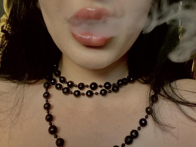 Flinty, minimalist design of five sleek, vertical, white-on-red, modernist-style letter "V"s stacked, creating a bold, geometric pattern. Simple, clean lines, subtle contrast. Modernist art.