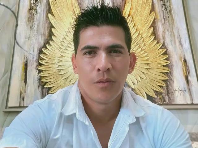 CaballeroDeLaNoches, a muscular guy with short black hair, wearing a white shirt, looking serious, golden angel wings in background, slightly sweaty face, medium skin tone, serious expression.