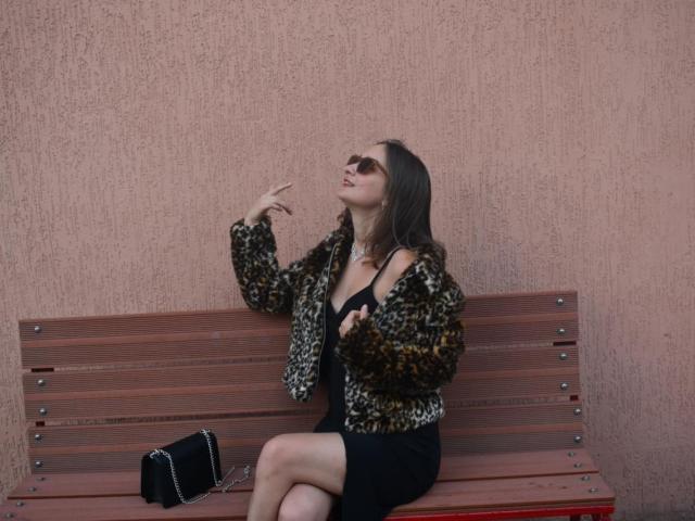 Close-up of a French flag, centered with a red vertical stripe and blue vertical stripe, flanked by white vertical stripes. The flag features a white Fleur-de-lis.