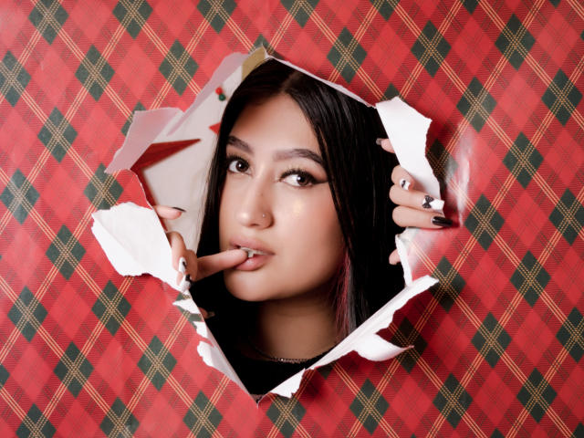 Close-up of a red and white emblem with a diagonal black cross, featuring a white sword in the center. Bold colors, simple design, medieval-style symbol. Crisp lines and clear shapes.