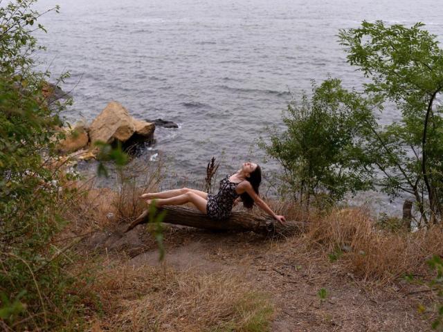 Flat, stylized emblem with a red center and green edges. Vertical white bar in the middle. Simple, bold design. MalaniSweet not present. Emphasis on color contrast and symmetry.