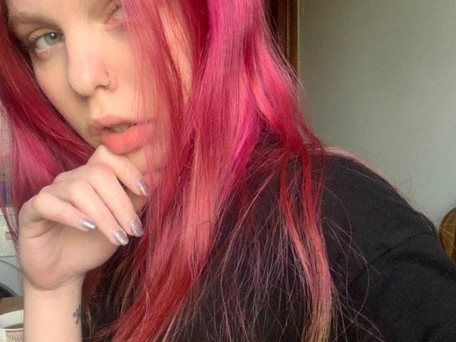 A digital illustration of a red, stylized letter "E" in the center, with subtle gradients and a slightly raised, textured surface. The letter is bold and prominent.