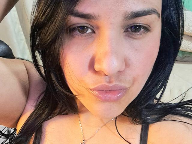 Digital art of a stylized, flat design featuring a large, central, pinkish-orange logo with black, angular lines and a smaller black logo in the bottom right. Clean, minimalistic style.