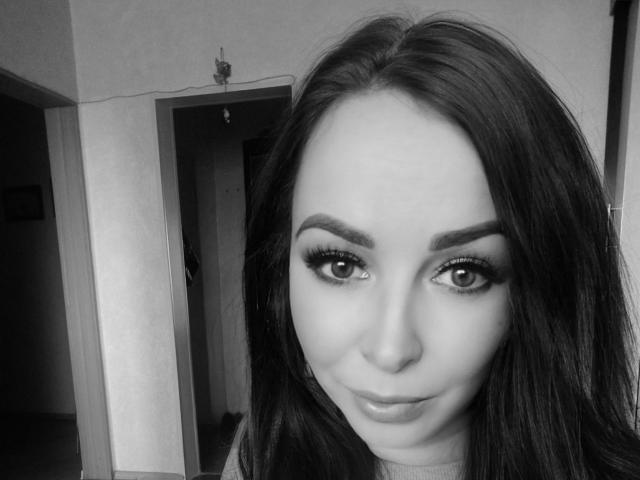 Minimalist art featuring a large, white, stylized letter "V" in the center. The "V" has bold, clean lines and a subtle gradient from dark to light. Simple and effective.