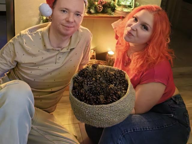 Digital illustration of a medieval-style banner with a red, white, and black pattern. Centered design with geometric shapes and a subtle gradient. Bold colors and simple textures.