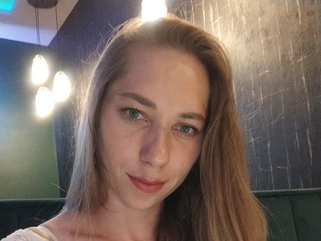 Flat, stylized letter "E" in the center. Light brown, slightly transparent, overlapping at the bottom. Simple, bold, and clean design. Red outline at the bottom edge. Minimalist.