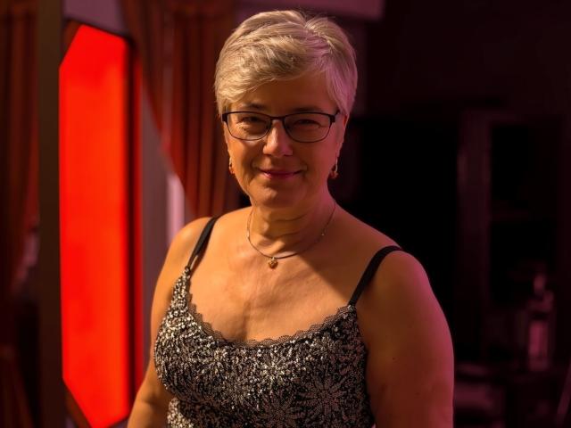 Flat design with bold red and white colors. Central, large red "L" shape. Small, detailed black and white pattern at bottom right. Simple, clean lines. Minimalistic, modern style.