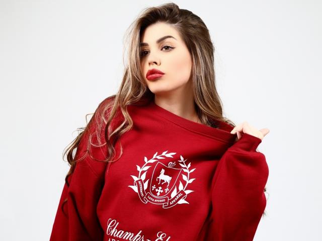 Red and white paper cut-out design with a flowing ribbon-like shape in the center. Simple, clean lines, and a flat, uniform texture. ValeriMair's name is not visible.