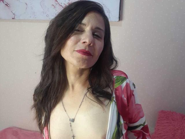 A flat, stylized design with a large, dark red letter "V" in the center. Surrounding the "V" are smaller, lighter red letters forming a border. Simple, bold colors.