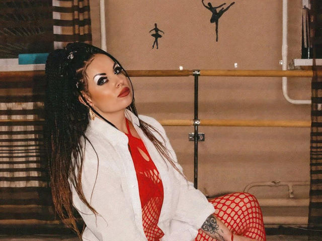 A flat, minimalist illustration of a coat of arms with a bold, red cross and a white shield. The emblem is centered with a simple, solid background.