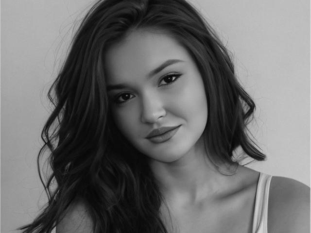 EvaLacroix has long, wavy dark hair, a cute smile, and subtle makeup. Her tits are small and her eyes are slightly tilted. She's wearing a white tank top.