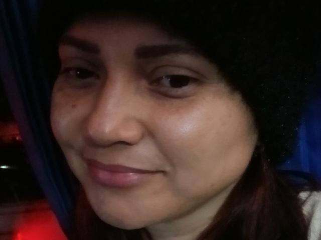 Sofia69s has a light brown skin tone, dark eyebrows, and a slight smile with pink lips. She's wearing a black headscarf, and her brown hair is partially visible.