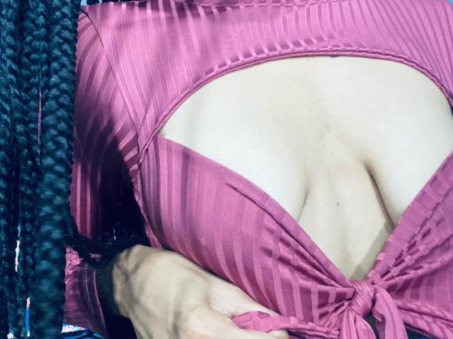 Digital illustration of a large, stylized letter "V" in soft pink. The letter has a slightly curved, elegant design with subtle shadows and a clean, minimalist style.