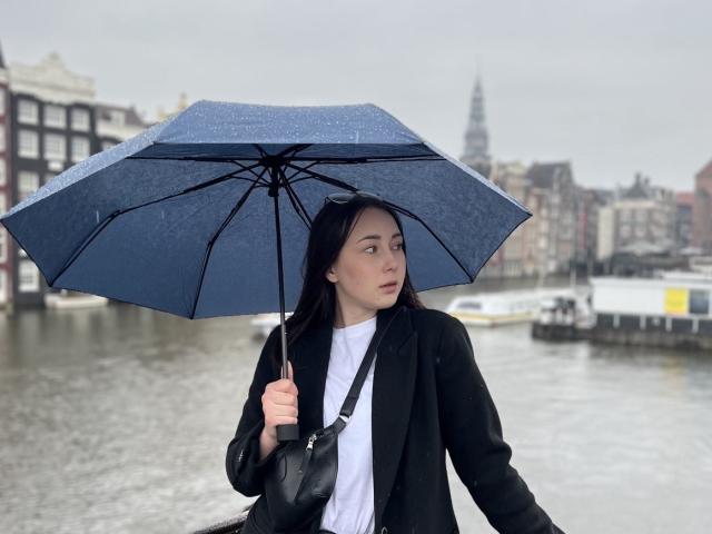 A minimalist, flat-design image of a stylized, black, geometric letter "A" in the center. The "A" has bold, clean lines with a subtle shadow. Bright, flat colors.