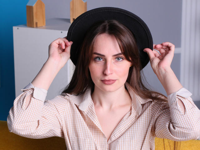 Digital art of a minimalist, flat-design style. Central white square with a smaller pink square inside. Background features a large pink square with a smaller white square inside.