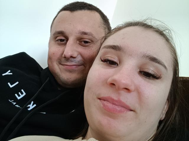 A flat, minimalist design featuring a large, white, stylized letter "L" in the center with a smaller black "L" at the bottom. Warm, muted colors dominate. Simple, clean lines.