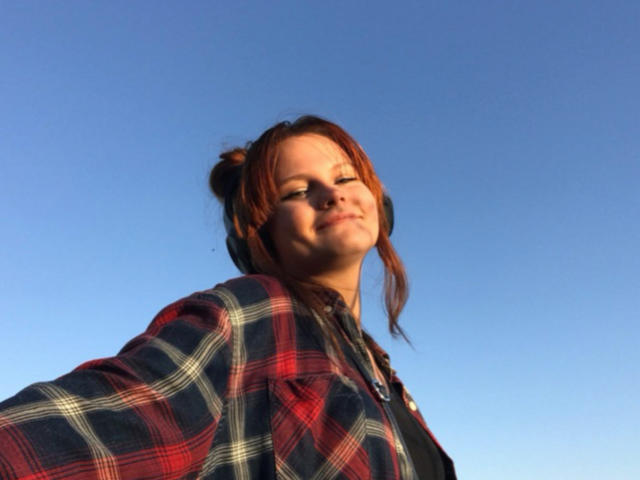 Flame-patterned coat of arms with bold red and orange flames, centered in a flat design. Simple, symmetrical composition. Flat colors, minimal shading. ReynaPearl's name is not relevant here.