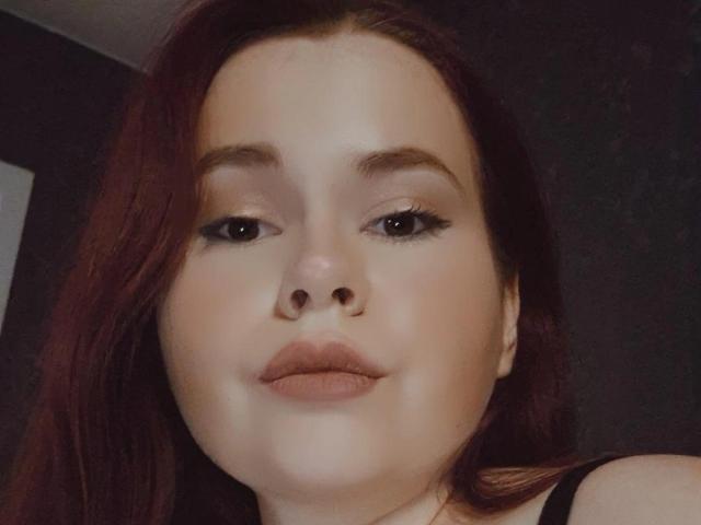 StefaniaLombardi holds a flat, stylized, red and white coat-of-arms. The emblem features bold, simplified shapes with a central red square and white border. Minimalistic, modern design.