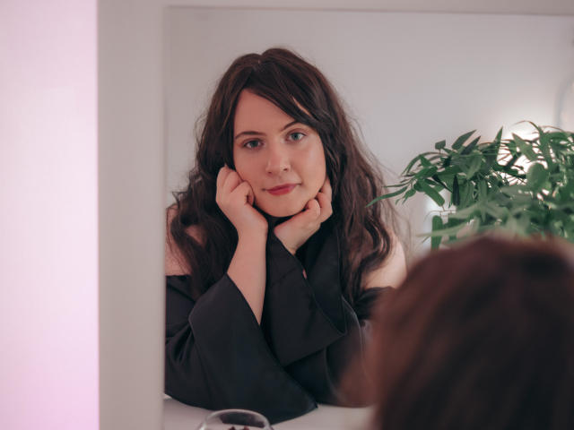 A flat, stylized letter "E" in bold red and white, resembling a modernist logo. The design is minimal with clean lines and a simple color palette. NanaMoonlight is not present.