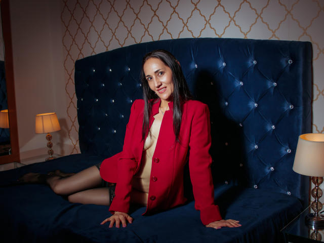 Digital artwork of a red and white flag with a central emblem, surrounded by smaller metallic elements. Clean, bold lines and flat colors. Minimalist, symbolic composition. MiaMott not present.