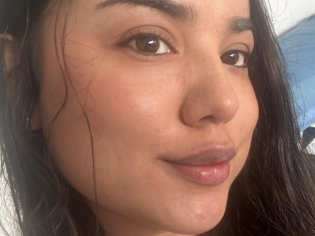 SteffanyTaylor's face, showing brown eyes, dark eyebrows, and slightly parted pinkish lips. She has light brown skin, long black hair, and a subtle smile. Her nose is small and slightly upturned.