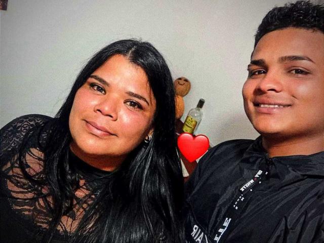LatinStyleX with long black hair and tanned skin, wearing a lace top, next to a LatinStyleX with short curly hair and tanned skin, wearing a black shirt.