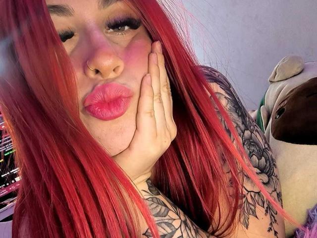 Digital illustration of a red banner with a white emblem, centered and slightly raised. Soft shadows, clean lines, minimal gradient. Banner features a small black emblem in the bottom right.