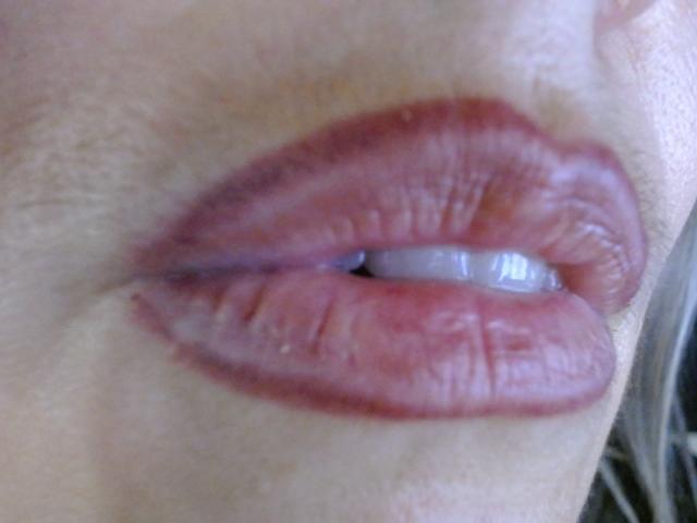 VickySexyFr's pinkish-red, slightly glossy, full lips with visible teeth and fine wrinkles. Her light skin shows subtle texture. The image is a tight, up-close shot of her lips.