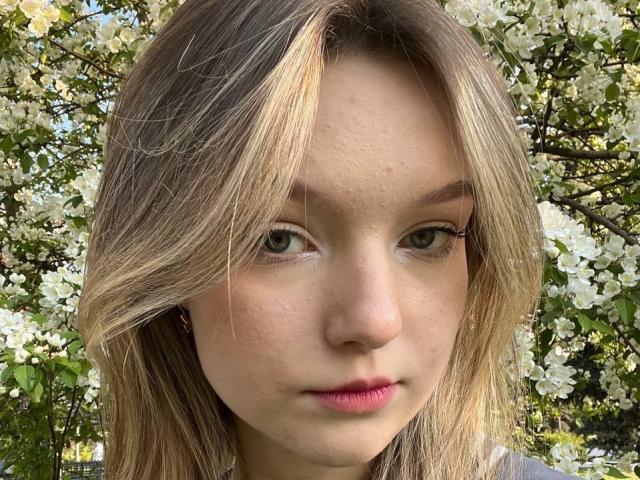 Minimalist digital artwork with a large, blurred, orange-pink central shape. French military flags in the background. Simple, clean lines. LateNightX is not present. Soft, muted colors dominate.