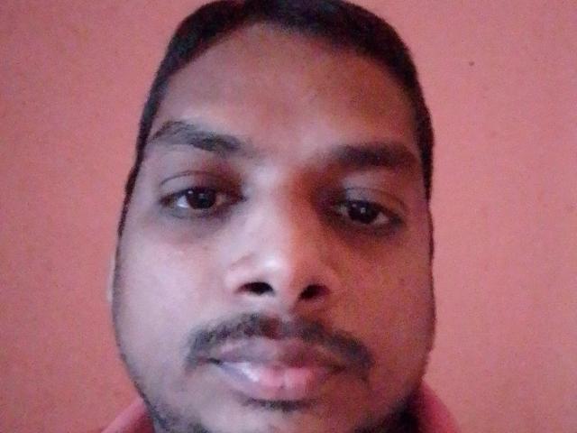Mihila69 has a dark-skinned face with short black hair, a small mustache, and a slight smile. Their eyes are medium-sized and brown. Mihila69's face is centered.