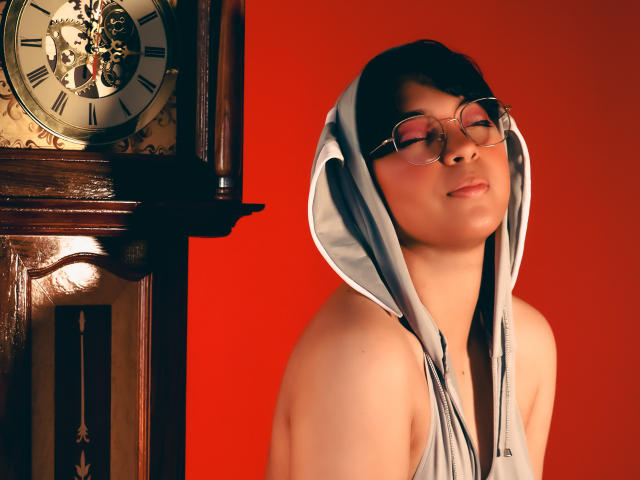 Flinty red and black coat of arms with a sword in the bottom right corner, symbolizing strength. Ornate emblem in top left. Bold, symmetrical design. NiaLe not visible.