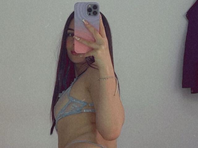 A flat, stylized design of a red and white flame-like symbol centered in the image. Bold, clean lines with a minimalist approach. NikoleFoster's name is not visible.