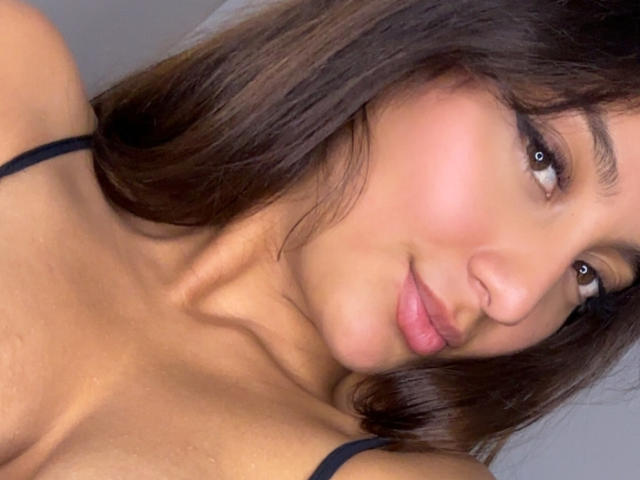 A flat, stylized, medieval-style coat of arms with a bold, red center and dark, black edges. Simple, geometric design with a slightly raised, three-dimensional appearance.